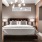 Modern bedroom with natural lighting and high ceilings in apartment homes at Flats at Ponce City Market