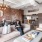 Resident sitting on a couch in modern apartment home at Flats at Ponce City Market